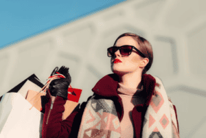 woman with various of drugstore makeup bags