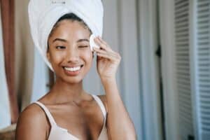 woman using makeup removal