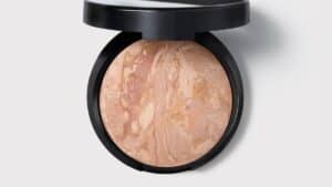 Laura Geller Baked Balance-n-Brighten foundation compact in Fair with kabuki brush
